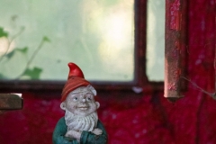 Garden gnome (Gartenzwerg) in telephone booth
