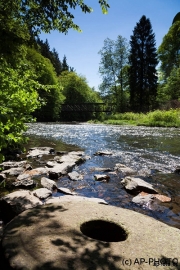 Millstone in the water